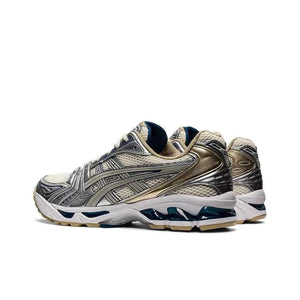 Asics Gel Kayano 14 حذاء ذهبي فضي.