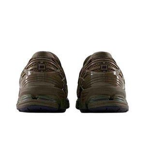Rear angle view of the New Balance 1906L Dark Olive showing the heel support and midsole cushioning.