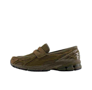 A lateral profile showcasing the New Balance 1906L Dark Olive loafer sneaker with its earthy mesh and synthetic overlays.