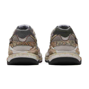 New Balance shoes custom edition by PandaPrank, heel perspective detailing distressed suede layers, textured camo trim, heel TPU clips, and weathered vintage-style midsoles.
