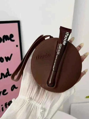 Rhode Beauty Peptide Lip Tint مع حقيبة سيليكون مطابقة اللون رود.