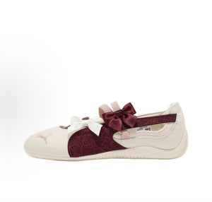 Puma Speedcat Ballet cream burgundy shoes side view displaying decorative ribbon bows design.