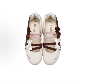 Puma Speedcat Ballet cream burgundy shoes top view showing crossover straps and bow details.