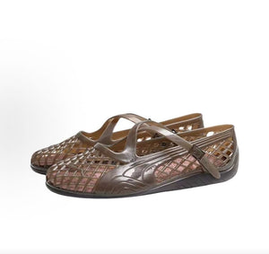 Pair of original Puma Speedcat Ballet Strap brown jelly shoes front angle view on white background.
