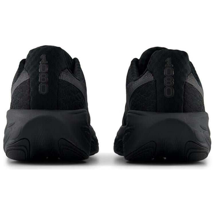 Direct rear view of a pair of all-black New Balance Fresh Foam X 1080 running shoes, displaying the vertical "1080" text on the heel pull tabs and the thick black midsoles