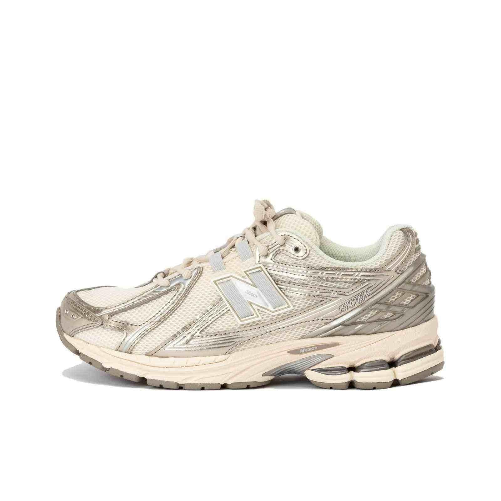 Lateral side view profile of cream and metallic silver New Balance running shoes.