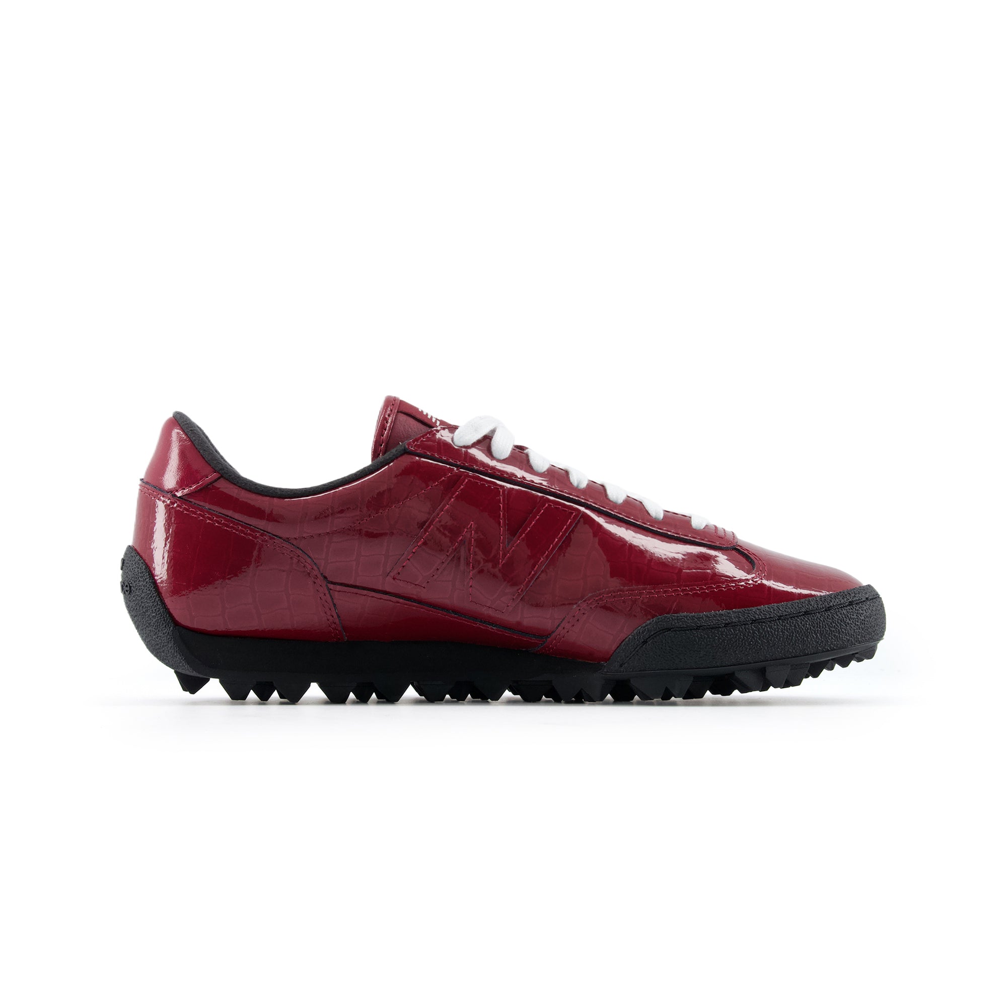 Medial side profile of burgundy patent leather New Balance RC30 shoes, featuring a glossy crocodile-embossed burgundy upper, matching patent leather N logo, white laces, black interior lining, and a black rippled studded rubber outsole.