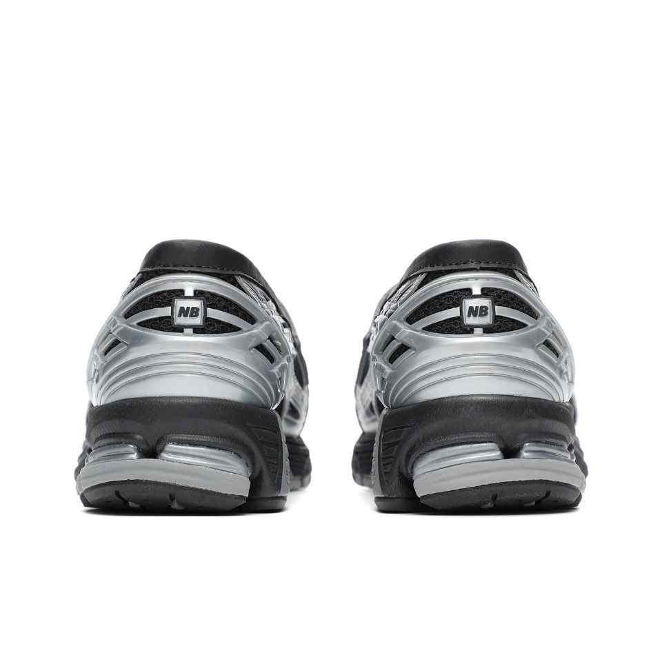 Rear angle view tailored for نيو بالانس للنساء والرجال highlighting heel structure and cushioning.