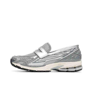 A side profile showcasing the New Balance 1906L Silver loafer sneaker with its unique metallic finish and mesh upper.
