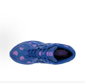 New Balance shoes 1906R model in blue polka dot colorway, top-down perspective showing blue and purple mesh uppers, structural synthetic overlays, lace tongue loops, and Ortholite inner soles.