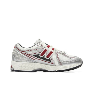 New Balance shoes 1906R running sneaker in white, metallic silver, and burgundy colorway, medial profile view displaying breathable mesh uppers, metallic synthetic cage overlays, red N-lock support lace webbing, and shock-absorbing N-ergy midsoles.