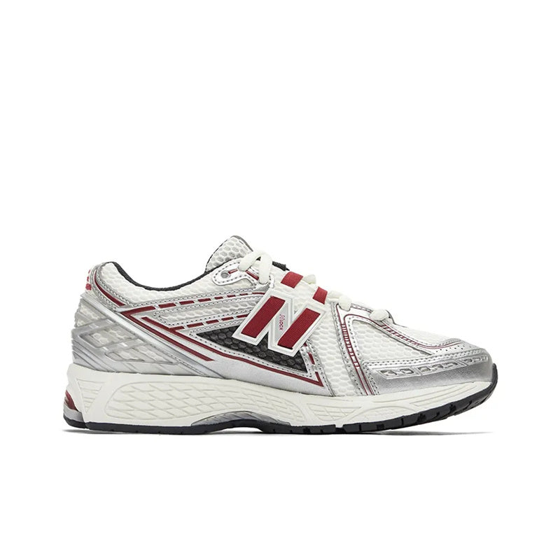 New Balance shoes 1906R running sneaker in white, metallic silver, and burgundy colorway, medial profile view displaying breathable mesh uppers, metallic synthetic cage overlays, red N-lock support lace webbing, and shock-absorbing N-ergy midsoles.