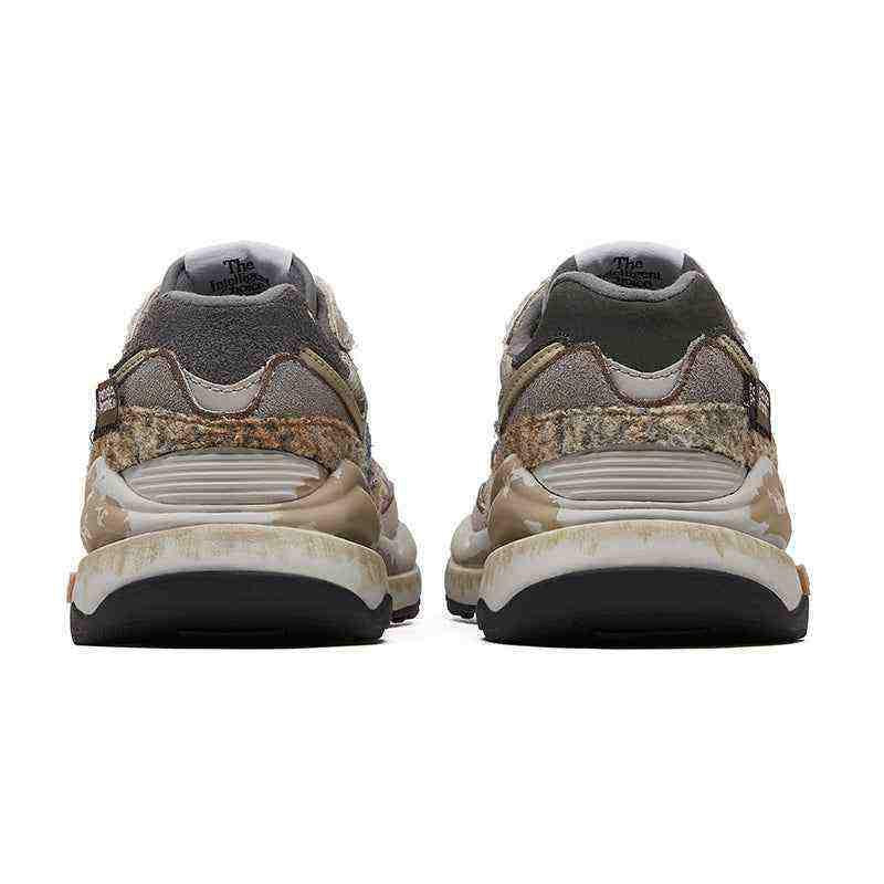 New Balance shoes custom edition by PandaPrank, heel perspective detailing distressed suede layers, textured camo trim, heel TPU clips, and weathered vintage-style midsoles.