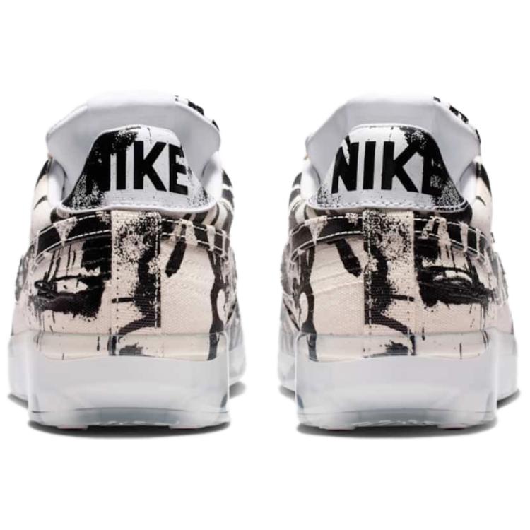 The rear view showcases Nike Shoes details, combining the حذاء نايك الأصلي مع ميزات حذاء نايكي جرافيتي أسود وأبيض | Nike Graffiti Black & White وجودة شوز نايك وتشكيلة nike schuhe.