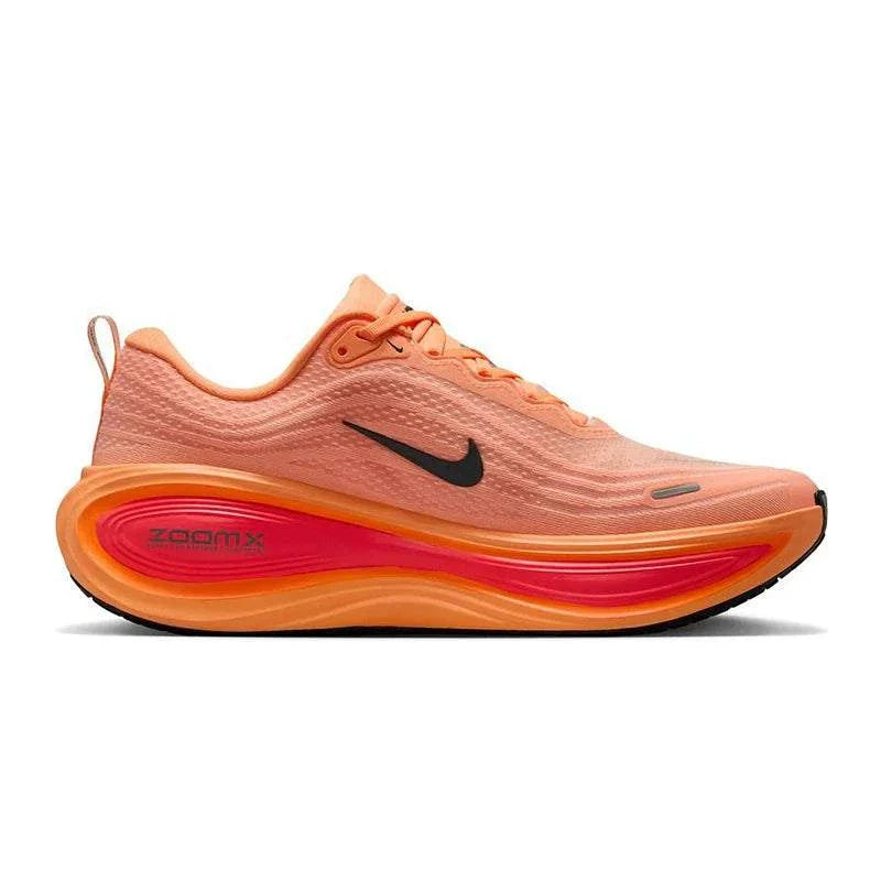The side angle view highlights Nike Shoes craftsmanship, showcasing the حذاء نايك الأصلي مع حذاء Nike Vomero Plus للجري على الطرق للرجال لون مرجاني ضمن أفضل موديلات شوز نايك وتصاميم nike schuhe.