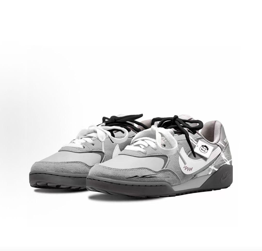 The angled perspective highlights Nike Shoes craftsmanship, showcasing the حذاء نايك الأصلي مع حذاء نايك أتاك رياضي رمادي | Nike Attack Grey ضمن أفضل موديلات شوز نايك وتصاميم nike schuhe.