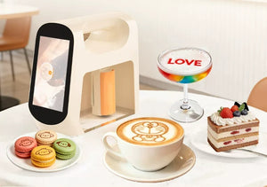 Product presentation featuring طابعة كافيهات ومخابز (Cafes and bakeries printer) surrounded by printed coffee, macarons, and biscuits.