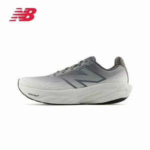 Side profile of a grey New Balance running shoe featuring a light-to-dark grey gradient mesh upper, dark charcoal "N" logo, thick light grey Fresh Foam X sole, and red logo branding in the top left corner