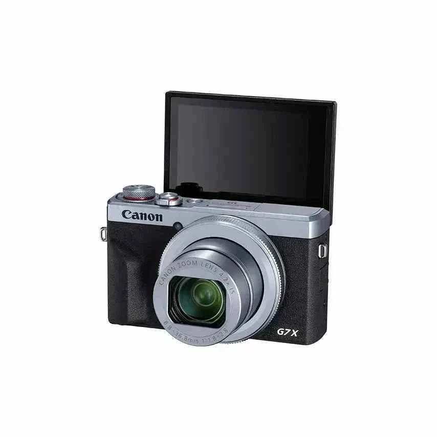 Front view of the silver and black Canon PowerShot G7 X Mark III with its 180-degree flip screen raised for vlogging