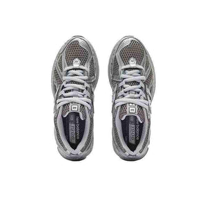 Top-down overhead view of dark grey and metallic silver New Balance running shoes