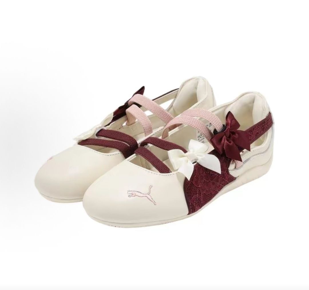 Pair of original Puma Speedcat Ballet cream burgundy shoes front angle view with bow accents.