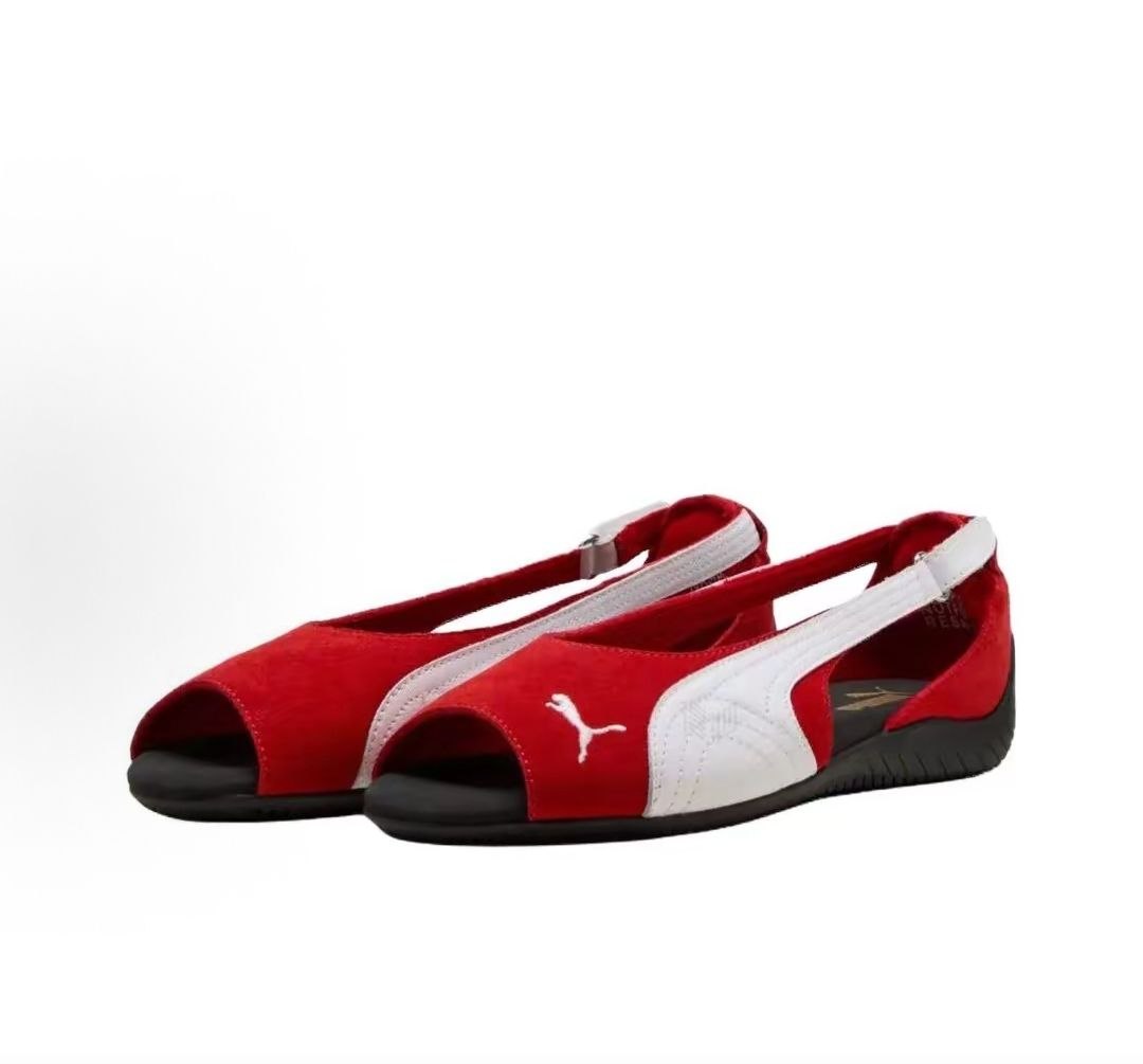 Pair of original Puma Speedcat Ballet open-toe red white shoes front angle view on white background.