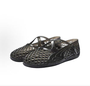 Pair of original Puma Speedcat Ballet Strap black jelly shoes front angle view on white background.